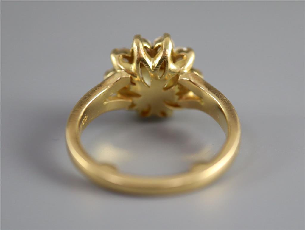 A modern 18ct gold and diamond cluster ring,